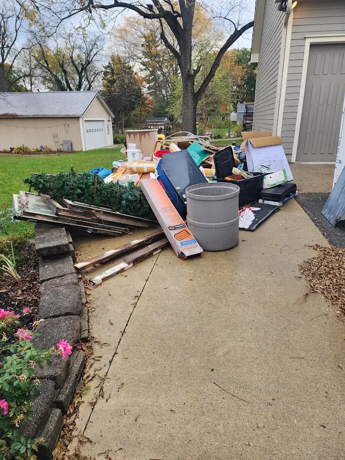 Dumpster being loaded with debris for 10 Yard Dumpster Rental in Cahokia Heights
